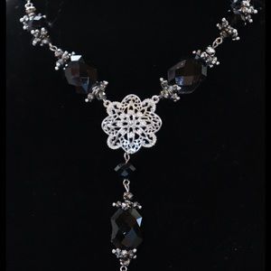 BLACK & SILVER NECKLACE WITH A 2 1/2” PENDANT DROP IS LIKE NEW